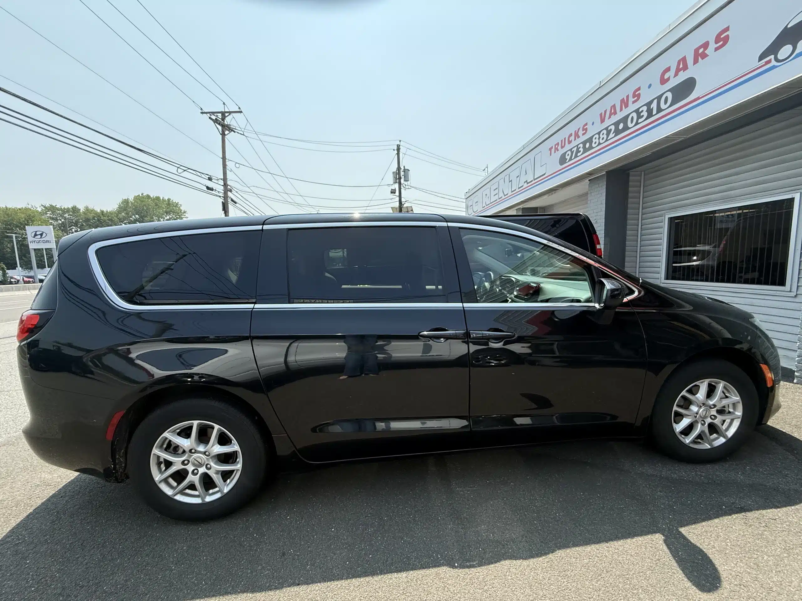 Black 15-person passenger van