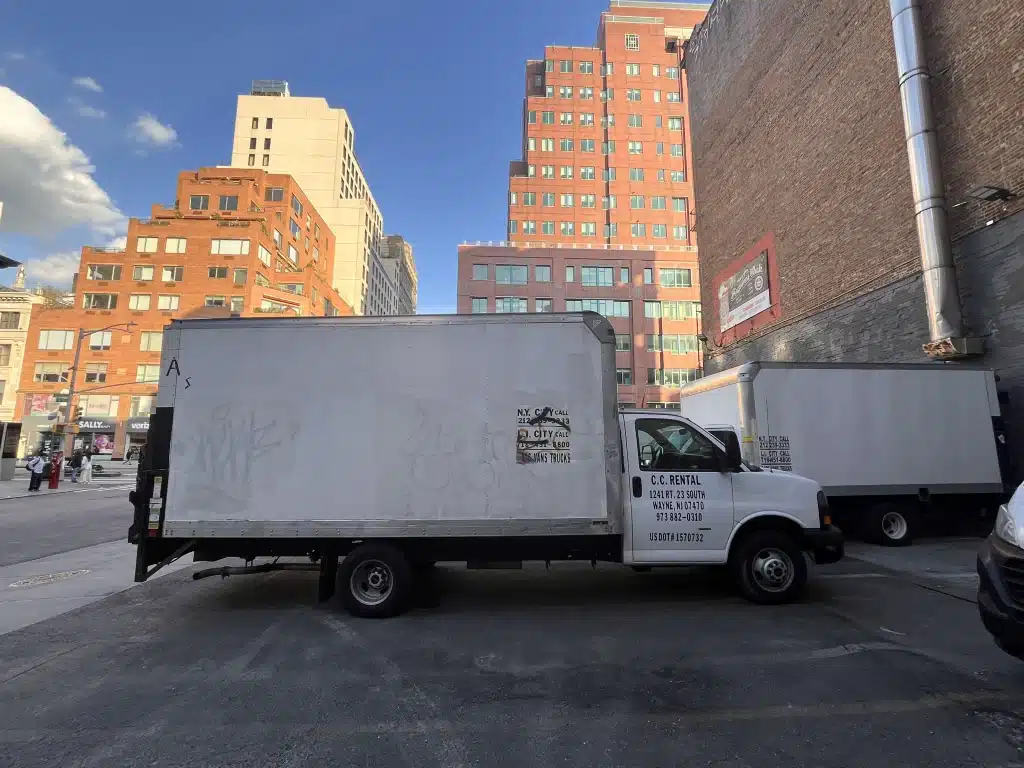 Box truck parked with New York City backdrop