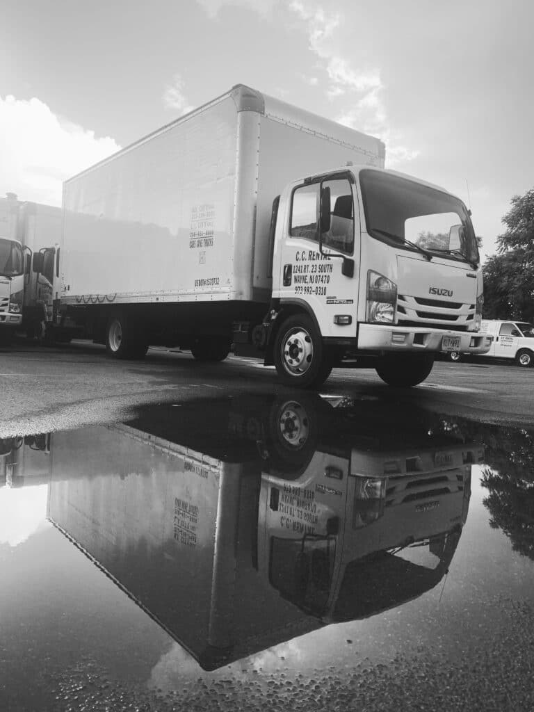 C.C. Rental box truck and reflection in puddle